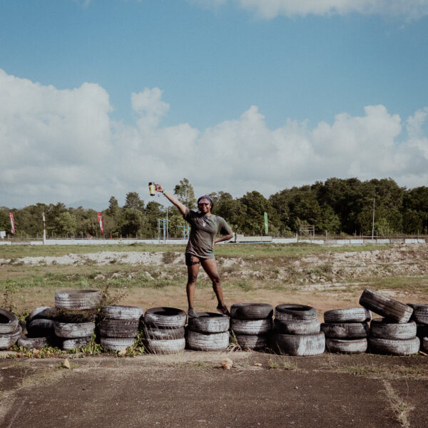 ne of the many Trinidad Carnival events or parties is Caesar's Army A.M. Bush, an all-inclusive J'ouvert alternative event that typically occurs on Carnival Saturday. In this image, the author poses for a photo at the end of the fete.